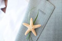 a star fish and herb wedding boutonniere for a seaside or beach groom