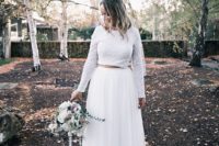 a white sparkling crop top with long sleeves, a white tulle maxi skirt with a train for a modern bridal outfit