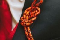 an orange rope wedding boutonniere is a lovely and bold piece to rock, with a nice knot