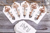 beautiful calligraphy wedding escort cards with lovely vintage keys for an accent and as favors are amazing for a wedding