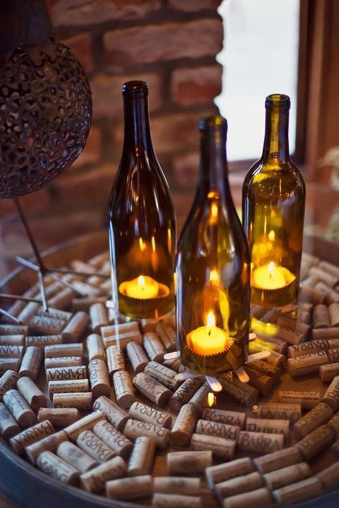 cozy wedding decor with wine corks, wine bottles with candles is very easy and budget-friendly