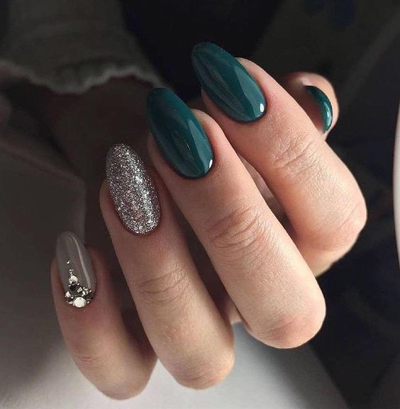 glossy hunter green, grey and silver glitter nails and an accent nail with heavy embellishments for the bride