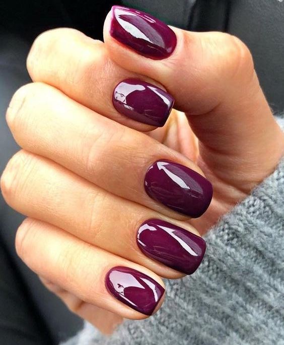 glossy purple nails are a perfect modern manicure for a fall bride that will bring a jewel tone to the outfit