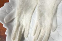 ivory and gold lace gloves with an elegant ribbon edge are chic accessories for a vintage bride