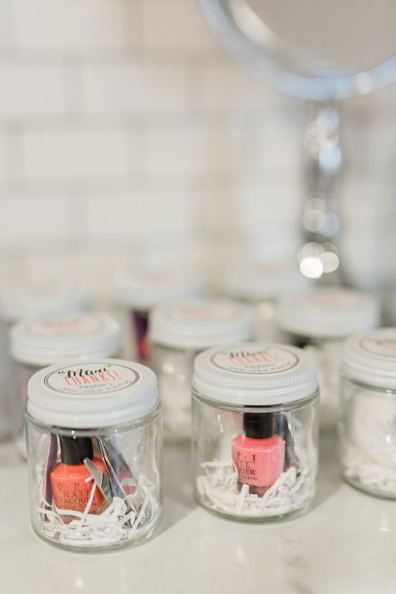 spa bridal shower favors - mason jars with nail polishes, various manicure stuff and cute tags on top
