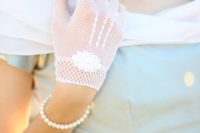 vintage white crochet gloves with patterns and an oval scallope edge applique are romantic