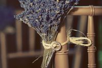 wedding aisle decor – a chair accented with lavender and a vintage key is a lovely idea for a rustic wedding