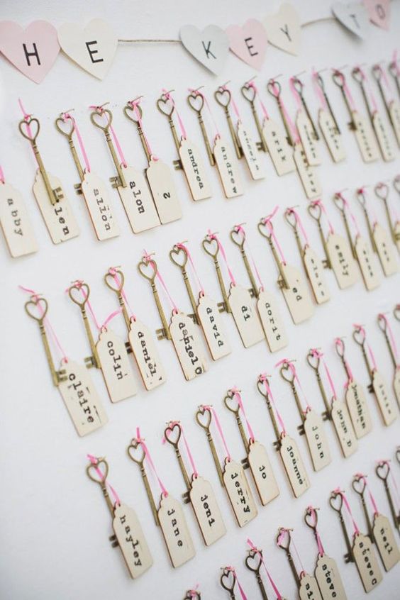 wedding escort cards with matching gold vintage keys with hearts and pink twine are amazing for a romantic wedding