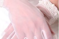 white mesh gloves with refined and wide pearl and bead wrists look very glam and elegant