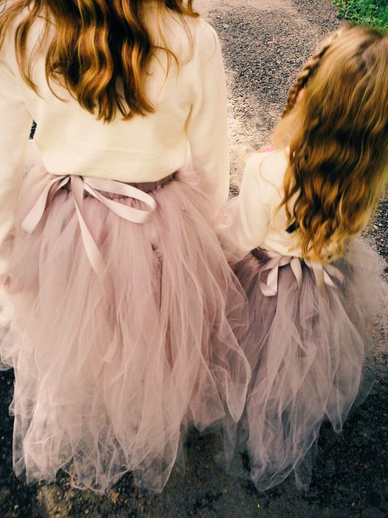 white sweaters paired with pink tutu skirts are great for winter and look chic and casual