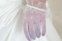 white tulle gloves with ruffles and a row of pearls look refined and chic and bring a romantic touch