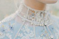 a boho winter wedding dress in blue with pretty detailing – lace appliques, beading and embroidery for a wow effect