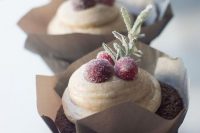 a gingerbread chocolate cupcake with cinnamon cream cheese frosting, sugared cranberries, herbs is a gorgeous solution for your winter dessert table