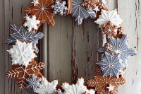 a glazed gingerbread cookie wreath of various snowflakes is a lovely idea for decor or for styling your wedding dessert table