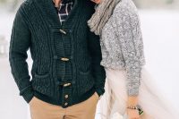 a grey knit sweater and a matching scarf , a graphite grey cardigan for warming up a winter couple