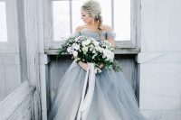 a grey off the shoulder princess-style gown with white layers for an ice queen look