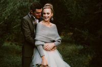 a grey off the shoulder sweater and a tulled skirt can be a nice and trendy bridal separate idea