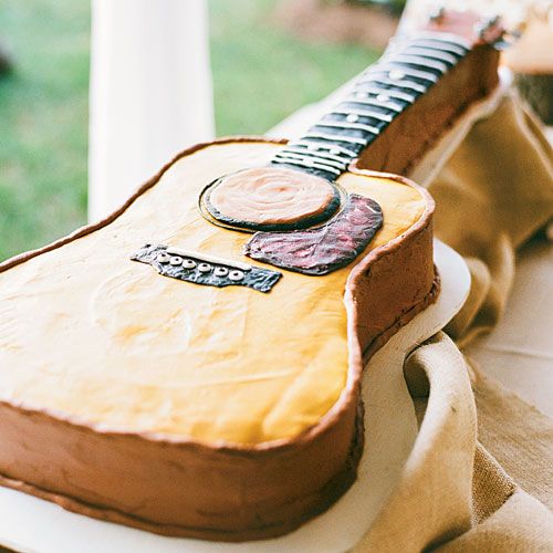 a guitar-shaped wedding cake speaks for itself - show off your main interest or hobby with such a statement cake