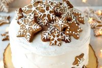 a rich fruitcake covered with marzipan & royal icing, topped with gingerbread stars and snowflakes is great for a winter wedding