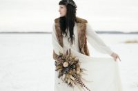 a simple boho look with a neutral vintage-inspired dress and a faux fur vest to feel warm