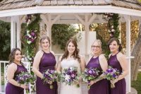 beautiful deep purple maxi bridesmaid dresses with halter illusion necklines and draped skirts look lovely and cool