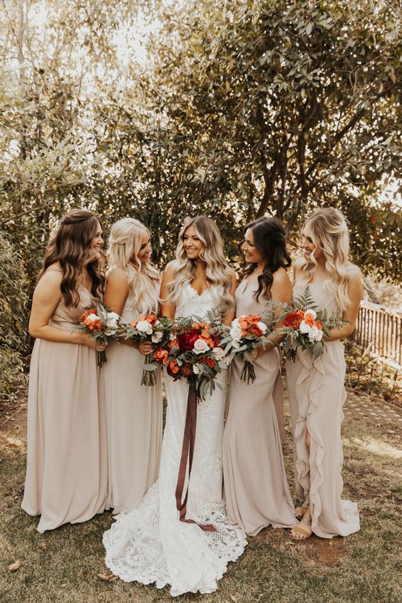 beautiful mismatching neutral maxi bridesmaid dresses with ruffles and draperies plus small trainers are a refined and chic idea