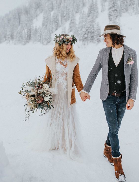 boho winter wedding outfits - a lace dress plus a shearling coat, jeans, a waistcoat and a blazer, a hat and boots