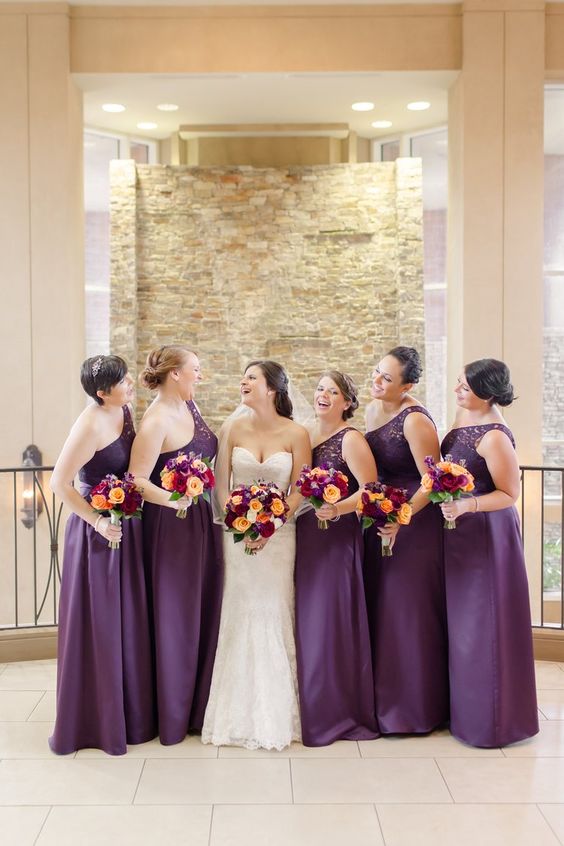 deep purple one shoulder maxi bridesmaid dresses with lace bodices and pleated skirts are amazing for fall weddings