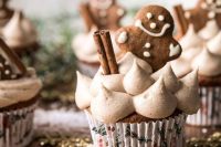 delicious gingerbread cupcakes with marshmallows, cinnamon sticks and gingerbread person toppers are amazing