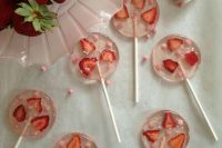 delicious starwberry lollipops with pink beads are fantastic for a summer wedding, make them yourself