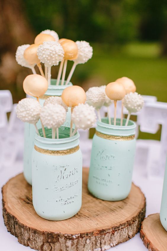 display your wedding cake pops in mint green jars and place them on your wedding dessert table