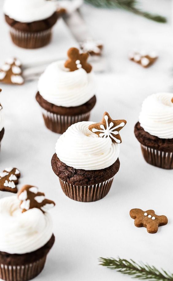 fantastic gingerbread cupcakes topped with delicious cream cheese frosting and mini homemade gingerbread cookies are idea for a winter wedding