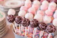 galvanized buckets filled ith confetti and with colorful cake pops are amazing for a modern and colorful wedding