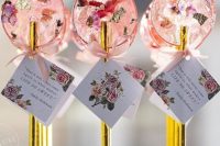 lovely pink dried flower lollipops with gold sticks and tags are fantastic wedding favors or escort card holders