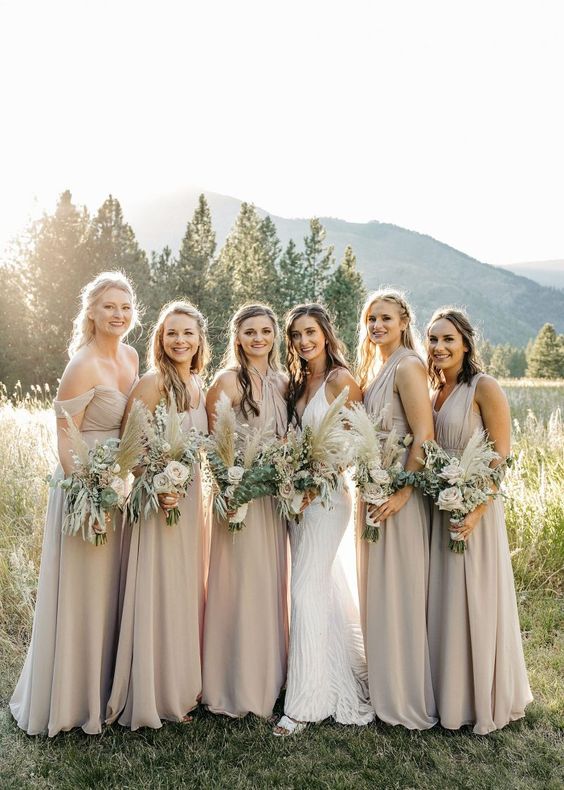 mismatching dove grey maxi bridesmaid dresses are a veyr chic and refined idea for a spring or summer wedding with a boho feel