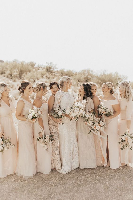 mismatching neutral maxi bridesmaid dresses in creamy, blush, light pink and tan, with embellishments and draperies are amazing