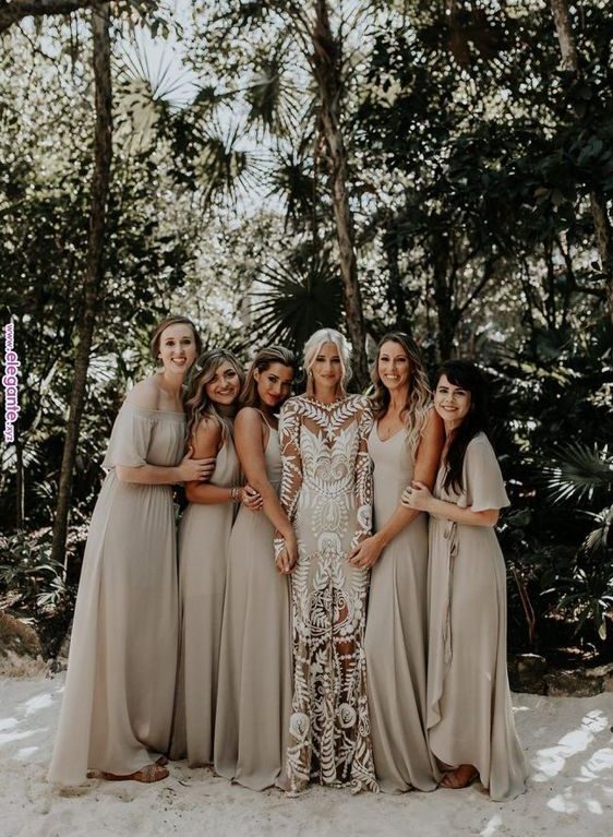 mismatching off white maxi bridesmaid dresses are right what you need for a trendy tropical wedding