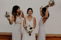 neutral minimalist maxi bridesmaid dresses with deep V-necklines and side slits are trendy
