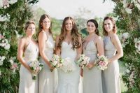 neutral mismatching maxi bridesmaid dresses will help the gals feel more comfortable on a hot day