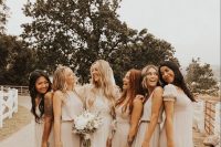 pretty mismatching relaxed maxi bridesmaid dresses in various grey tones are a gorgeous idea for a boho wedding