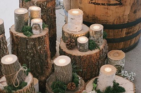 tree stumps and wood slices, moss, greenery and white blooms plus candles for chic and cozy rustic decor