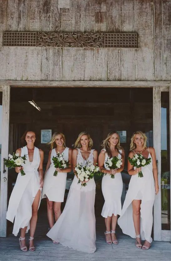 white bridesmaids' dresses - a high low with spaghetti straps, midi and mini with thick straps and a front slit one with thick straps