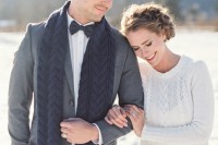 a white cable knit bridal sweater and a navy cable knit scarf to tie up your couple look