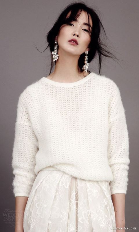 a white slouchy sweater over a romantic wedding dress will keep you warm and show off the skirt anyway