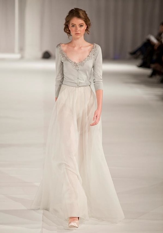 a grey cut out embellished cardigan and a neutral skirt for a chic and refined bridal outfit