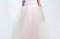 a short sleeve white sweater and a blush tulle skirt for a modern and simple bridal look