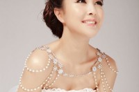 a super glam gold and rhinestone shoulder jewelry piece with gems and flowers is a romantic item