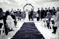 a cool wedding ceremony on top the mountain for a snowboard wedding