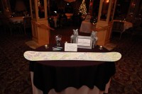 a simple and fun wedding guest book made of a neutral snowboard will highlight your wedding theme