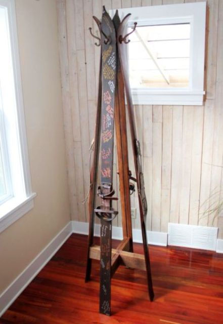 use skis with wishes to make a clothes rack for your home - this way these wishes won't be wasted